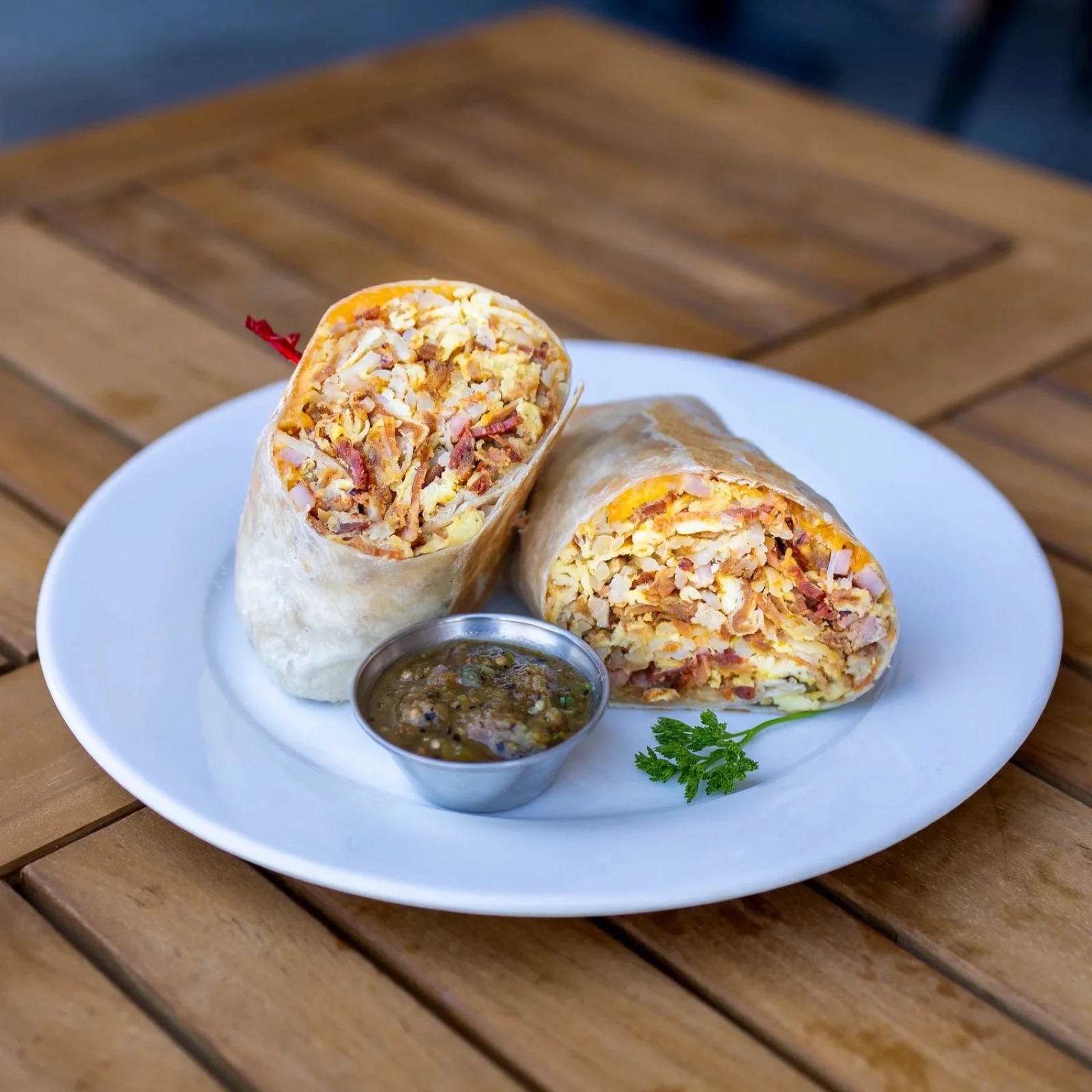 Garcia Bros Cafe Supreme Burrito with eggs, bacon and ranchero sauce