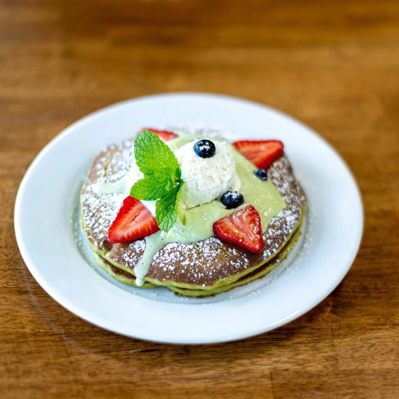 Matcha berry pancakes with whipped cream